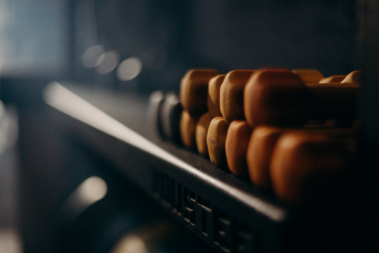 A shelf filled with weights, symbolizing muscle gain through protein.
