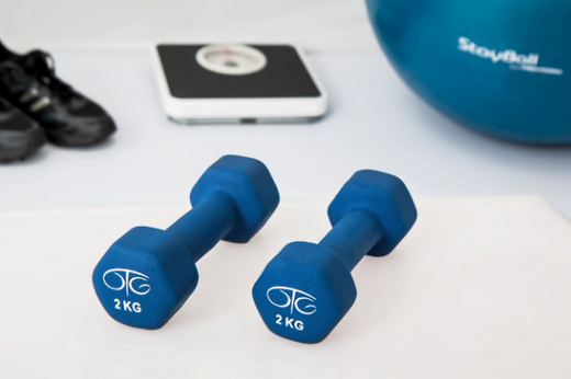 Weight training equipment: dumbbells and fitness tools.